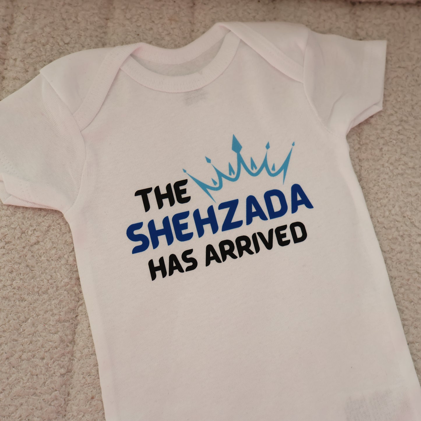 The Shehzada Has Arrived Short Sleeve Onesie – White (3–6M)