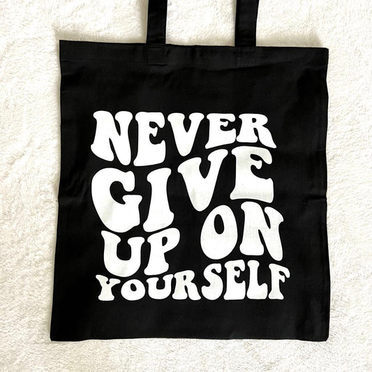 "Never Give Up On Yourself" Tote Bag